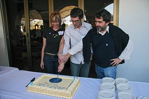 Naomi Andrew, Michael Lawley, Zoran Milosevic, mutually attack the cake,  | DSTC Farewell Symposium, 28 July 2005  | 